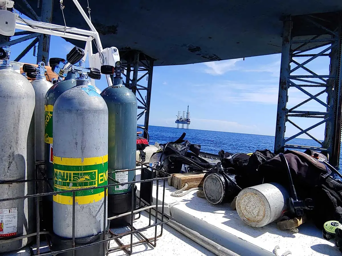 NAUI dive tanks on the Diver I deck with rig in background