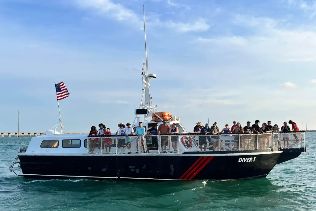 Passengers aboard the M/V Diver I on the bay behind South Padre Island